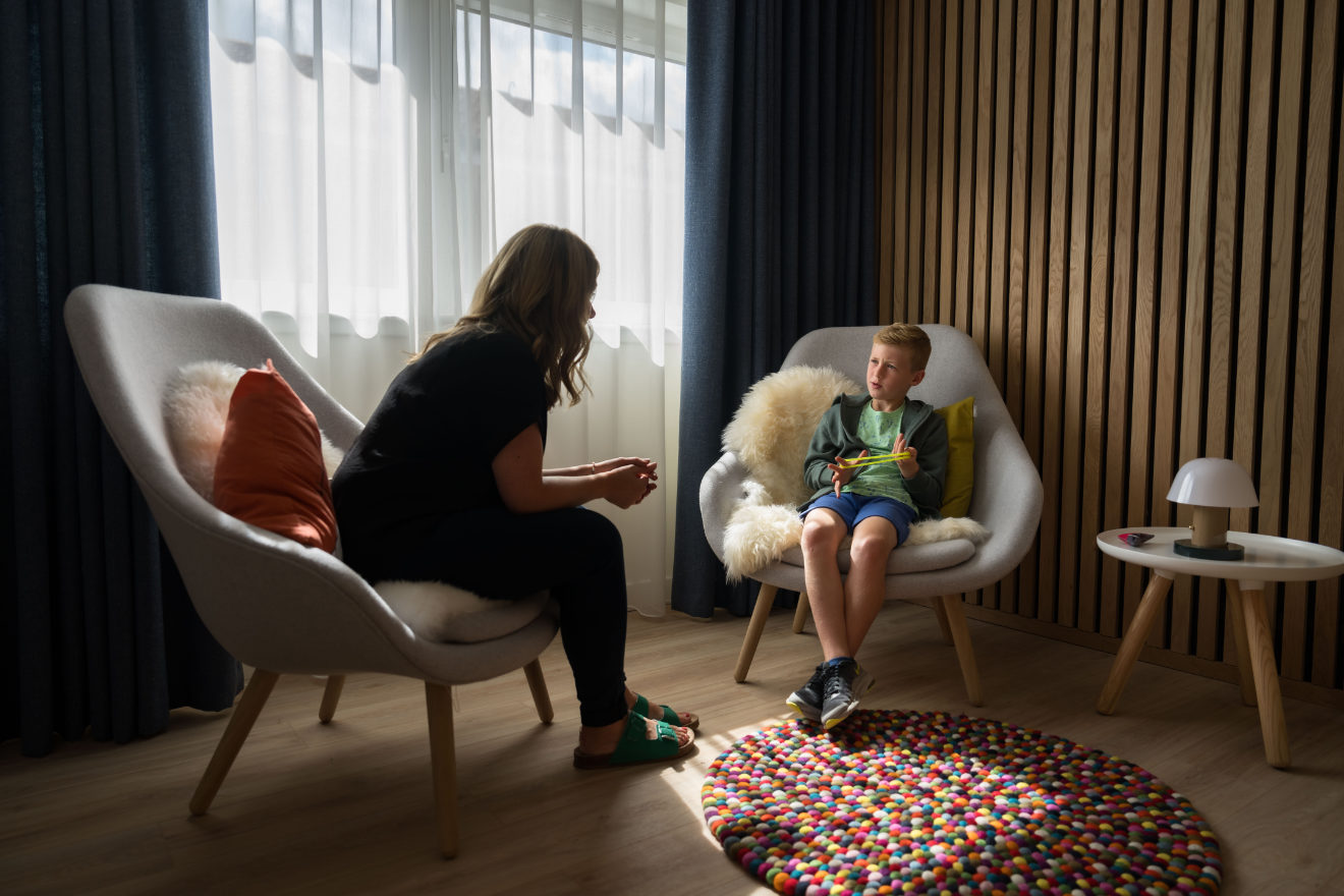 Child in conversation with an adult