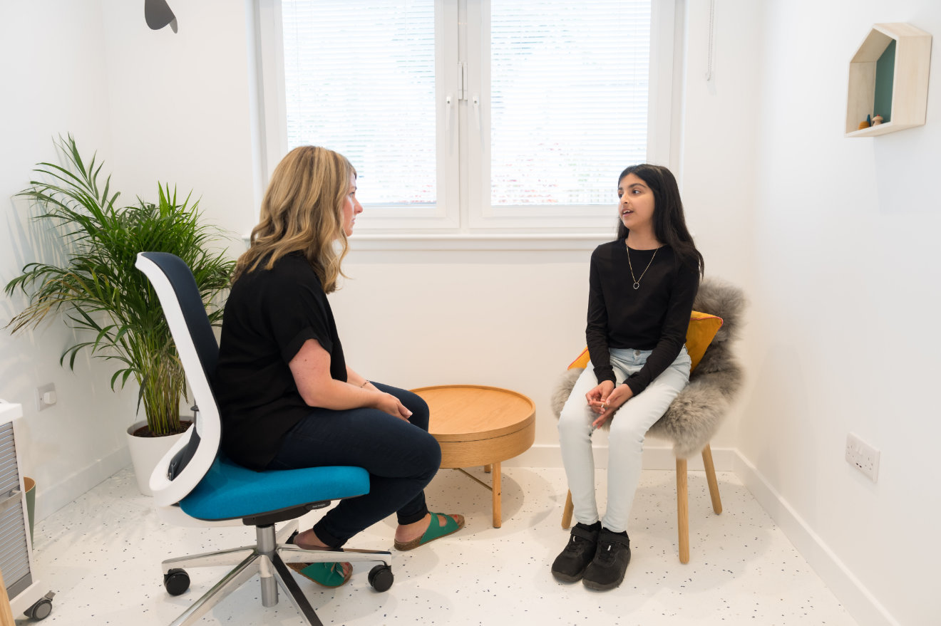 Child and adult in conversation